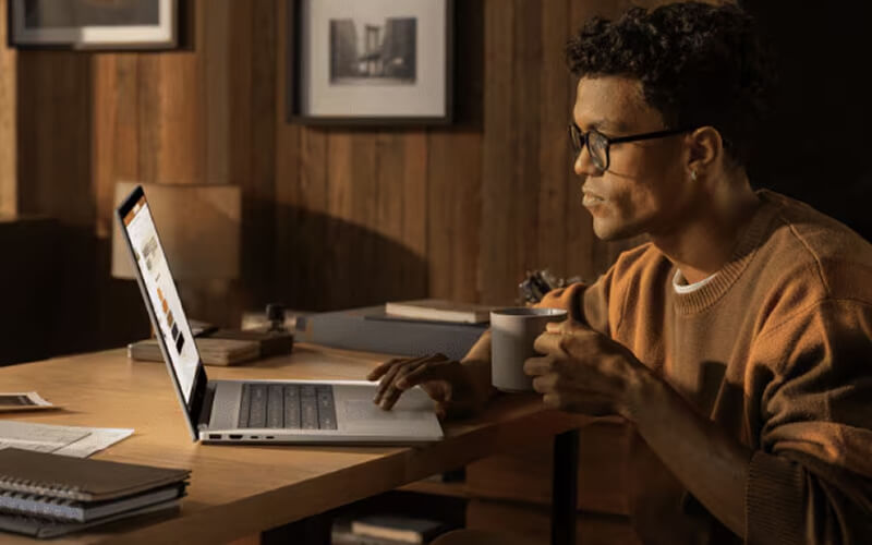 Business professionals working with HP devices in meeting