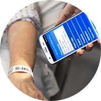 Nurse holding a Zebra healthcare device