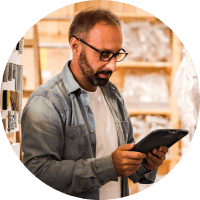 Guy on tablet in warehouse