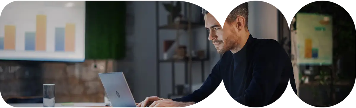 Team collaborating on laptops while conducting an AWS Well-Architected Framework Review to evaluate security and reliability.