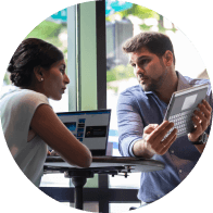 Regional manager has conversation with a member of his team