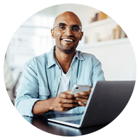 Man smiling using his phone