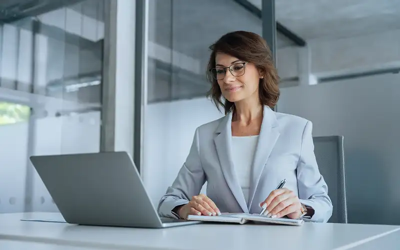 Business professional using automated workflows and self-service tools. 