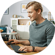 Businessman working remotely from home on laptop computer