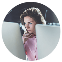 Woman focused at work looking at monitor