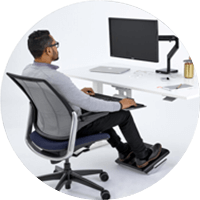 Man sitting using ergonomic chair