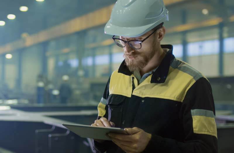 Engineer Using Tablet at Workspace