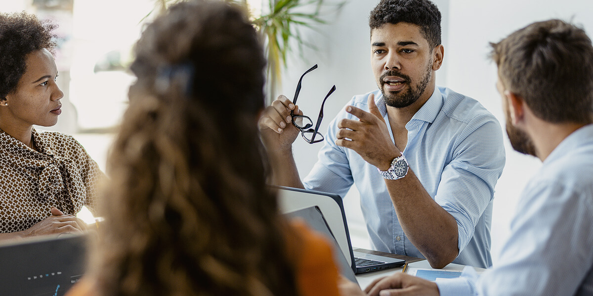 Business team has discussion in conference room