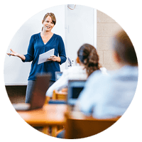 Close up of female teacher smiling using tablet device