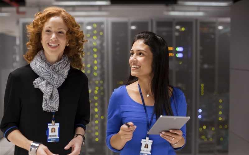 Two women smiling in data centre