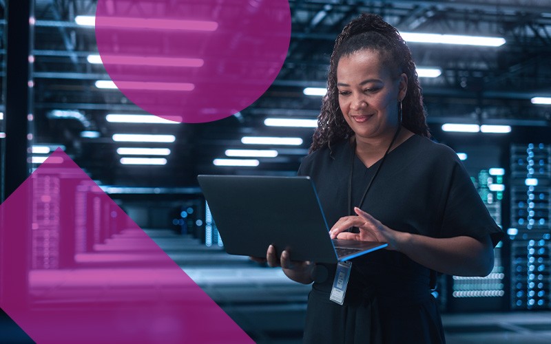 woman using laptop in data center