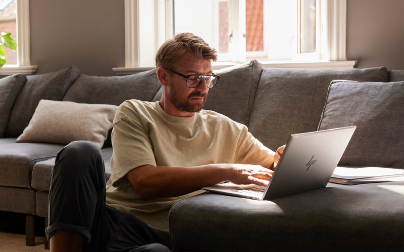 man working on laptop in a living room