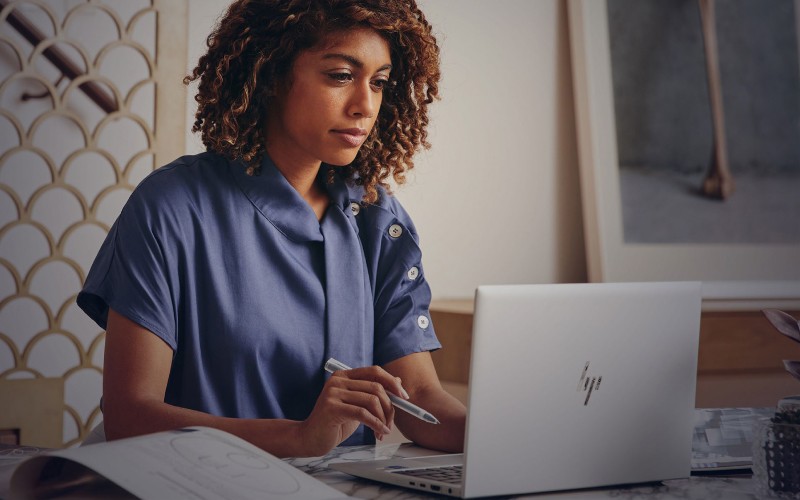Woman working on computer at desk
