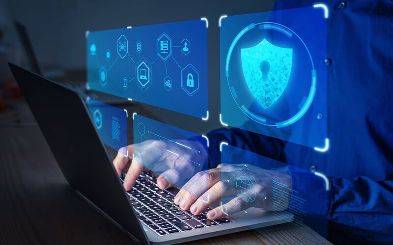 Person typing using a laptop