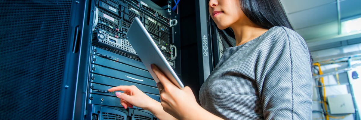 6 SQL Server 2016 Features That Make Upgrading Worth It Young engineer businesswoman with tablet in network server room
