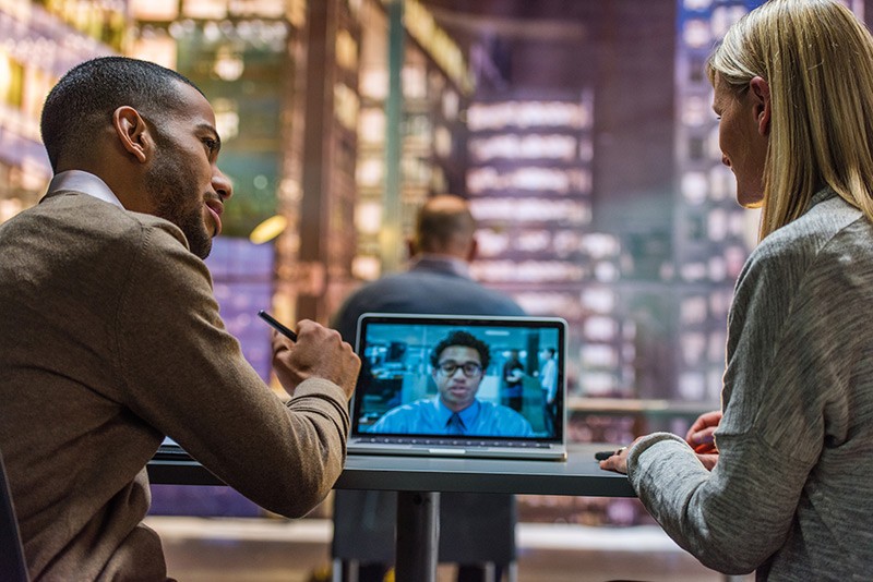 Business team communicates via video chat during meeting