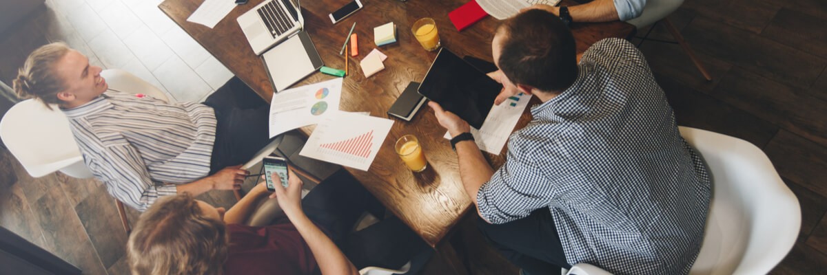 Driving Workforce Productivity With Adobe DC Business team brainstorms in the workplace in the office