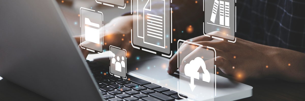 Abstract concept of cybersecurity and data management overlayed on laptop computer