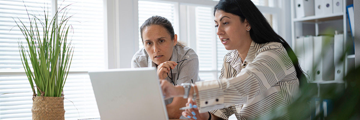 People looking at a laptop