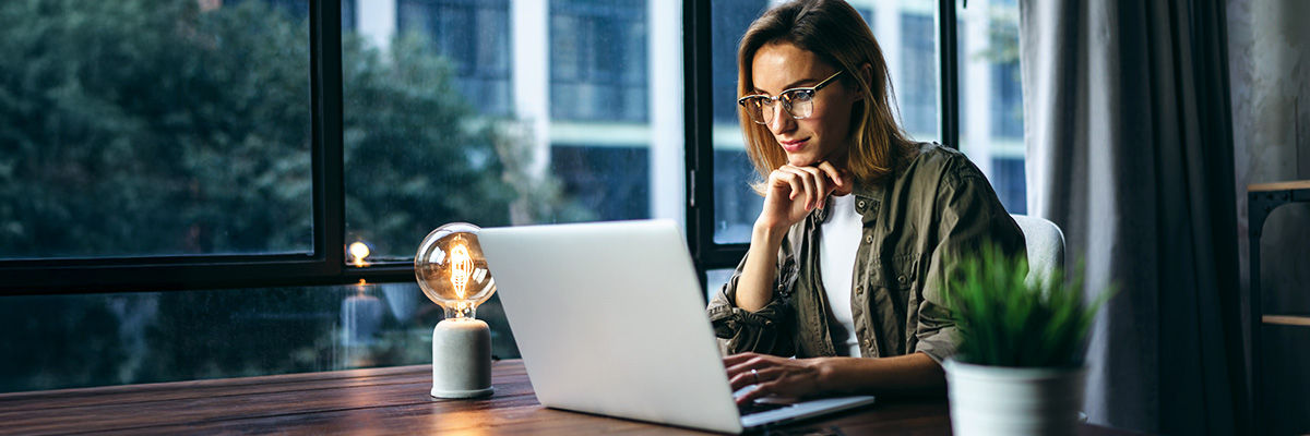 4 Reasons to Embrace AI PCs Now Woman on laptop