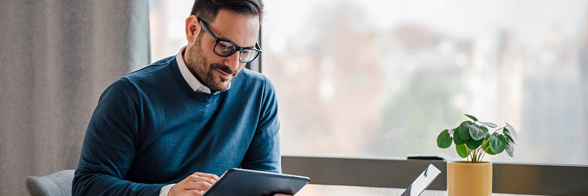 Man on tablet in office