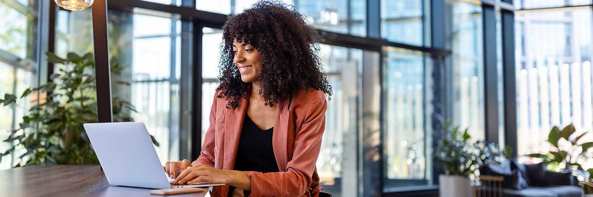 Girl smiling at laptop