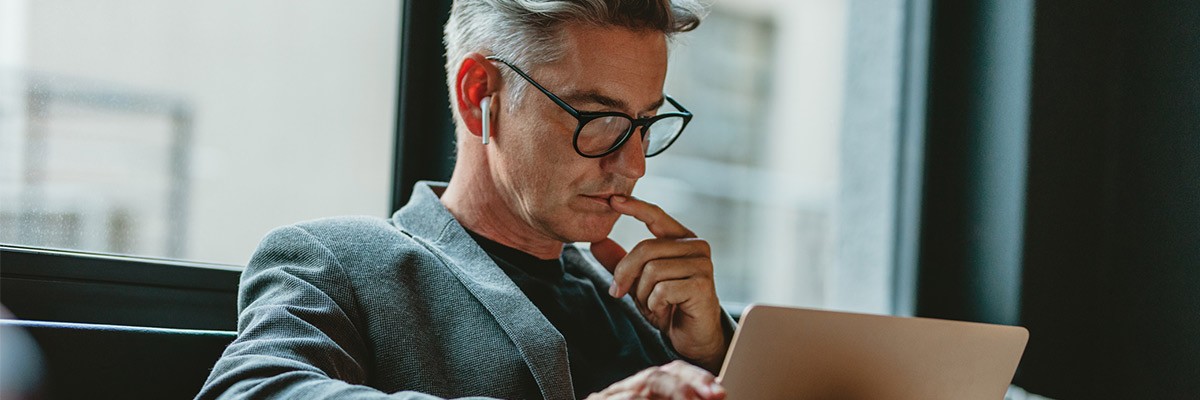 Smart Strategies for App Transformation with Insight + AWS Businessman working on a laptop