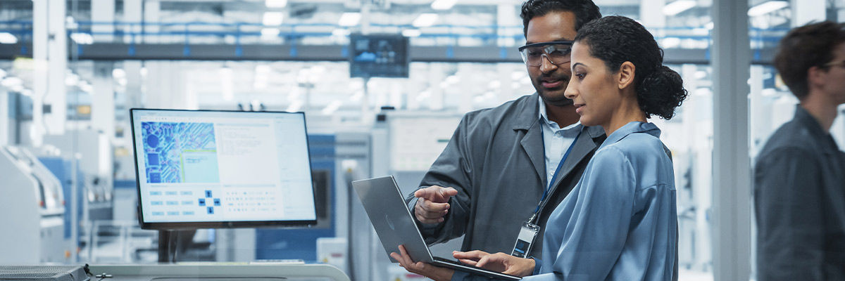 Factory workers on laptop