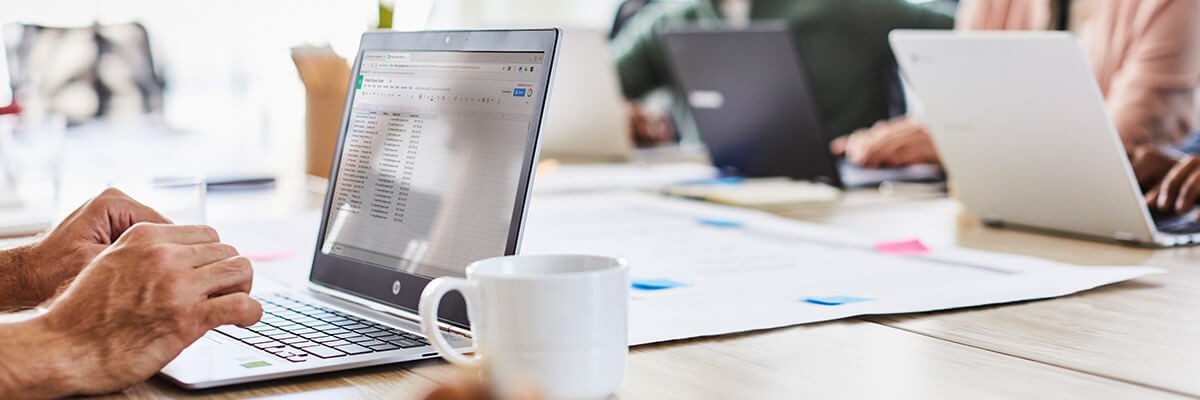 Man working on laptop banner