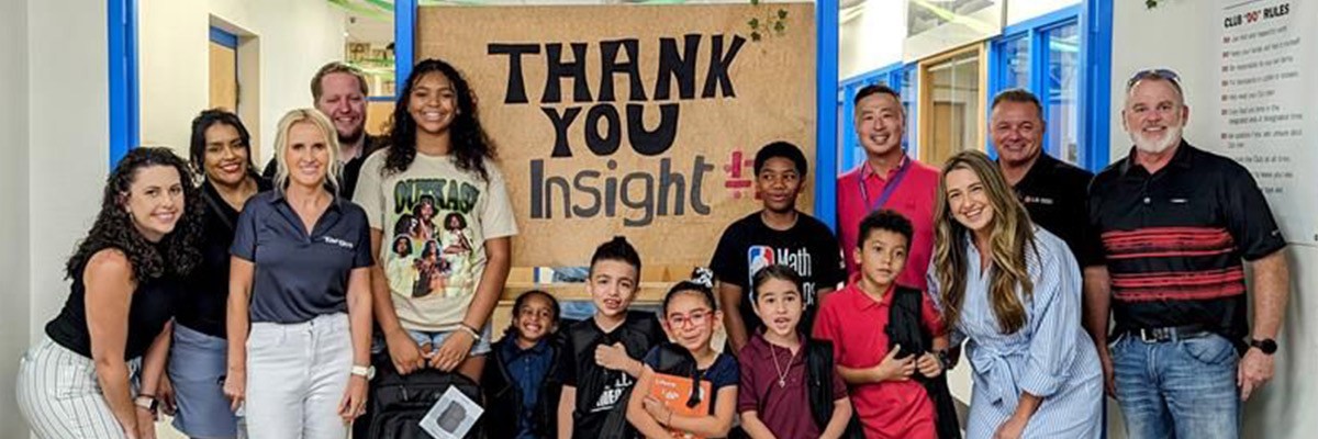 Brock Jacobs Insight employee Brocks Jacobs in front of Insight building sign