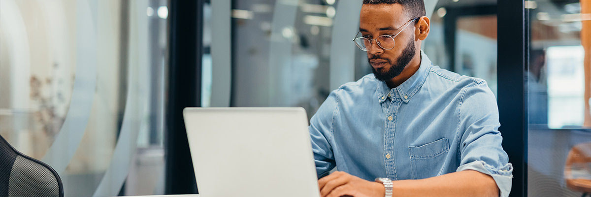 Man working on laptop.