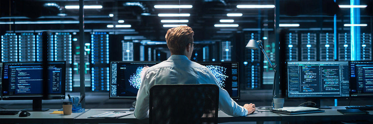 Guy on computer doing work.