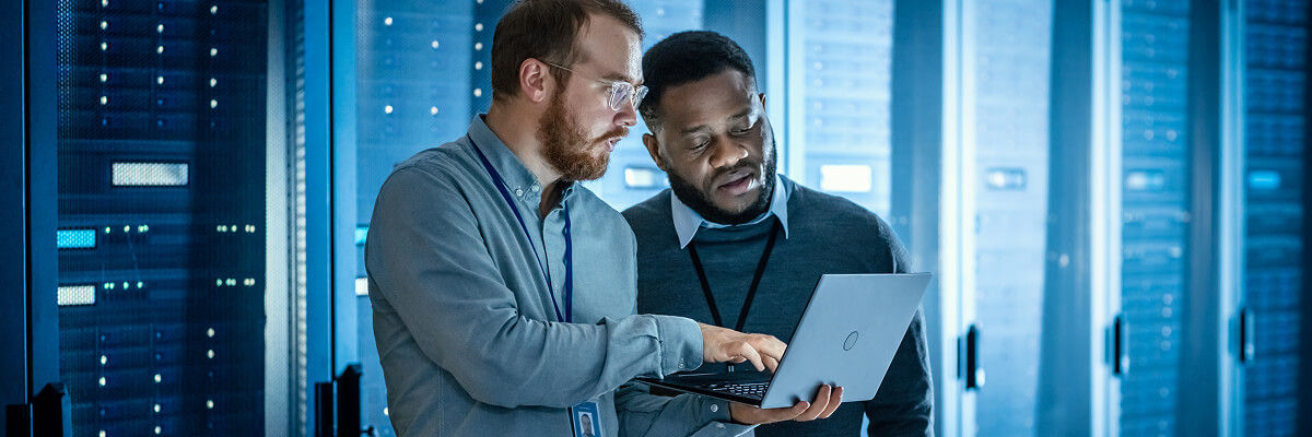 Data center workers on a laptop