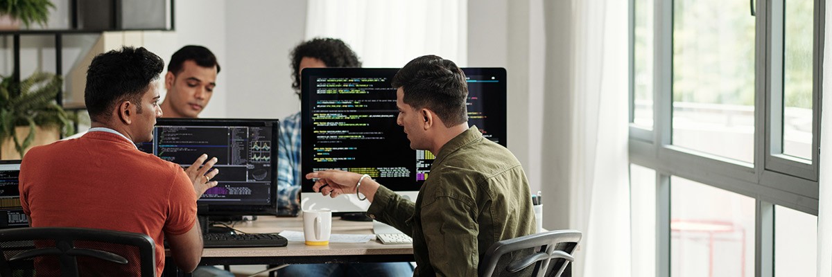 Platforms as a Product: Turn Your Barriers Into Enablers Devs working in open office cover