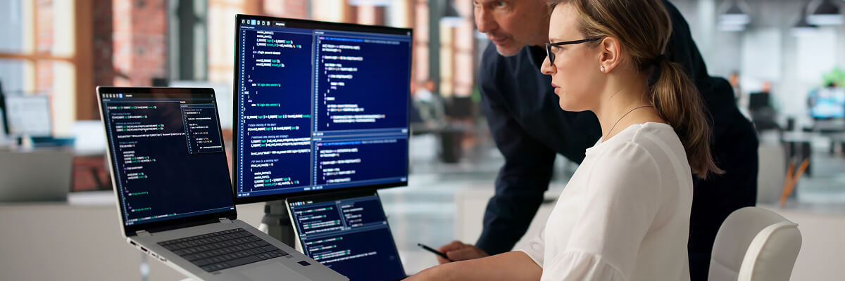 Proving Your Kafka Migration Worked People coding on desktop.