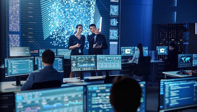 People in meeting room discussing strategy