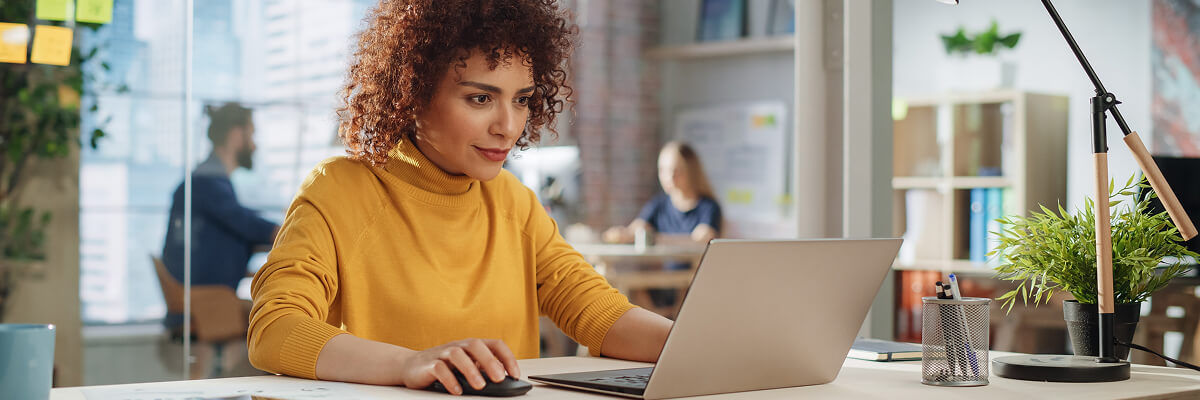 Where Should Analytical Versus Transactional Data Live Inside Databricks? Girl on laptop working.
