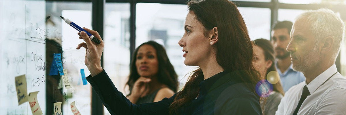 Girl writing on whiteboard
