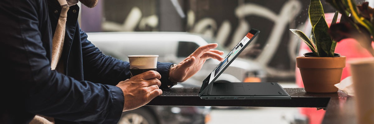 Businessman working remotely with an Acer TravelMate notebook