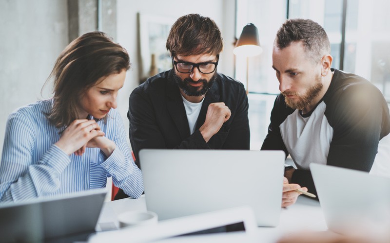 Team working on laptop