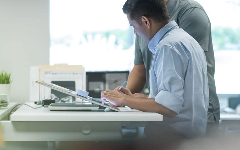 4 Reasons to get help with enabling Mac two people collaborating in an office