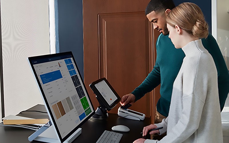 Woman in retail store using Microsoft Surface