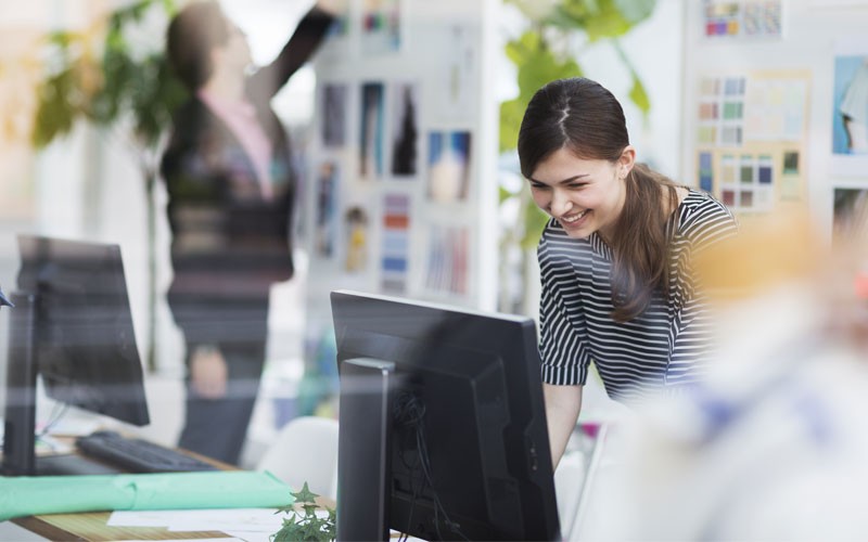 Business woman working on computer in office
