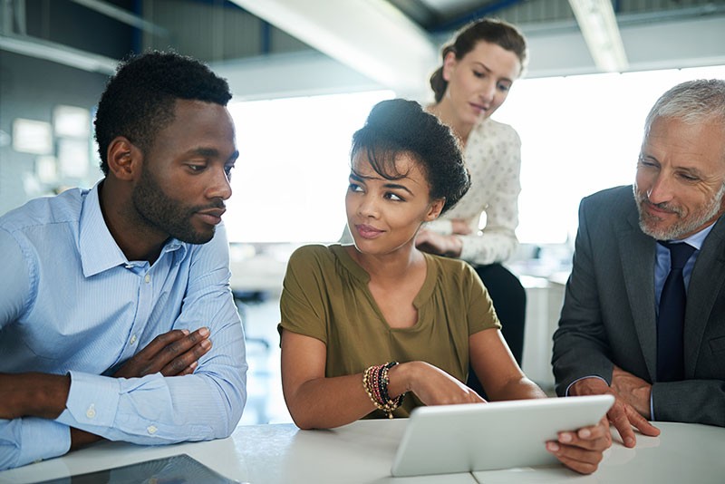 Woman working on tablet computer in casual office
