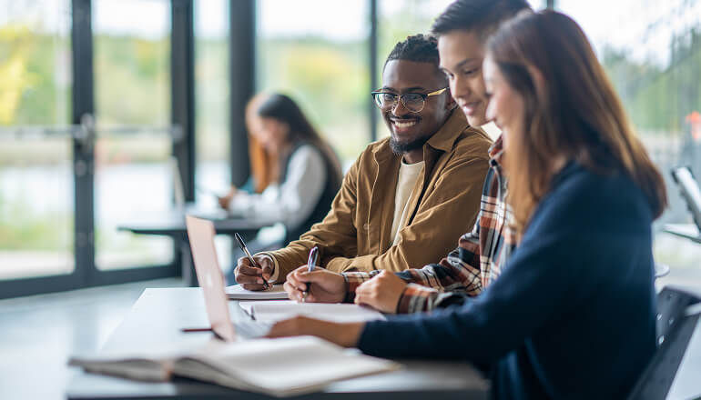 Christopher Newport University Pioneers Immersive AI for Arts Students working on a laptop