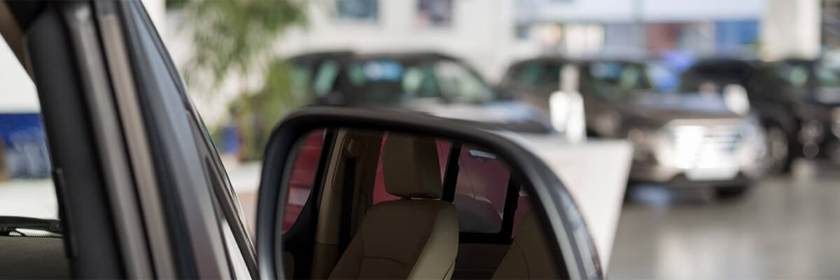 Cars featured in a car show room. IT security, Cisco Meraki, Cisco Umbrella, Cisco AMP for Endpoints