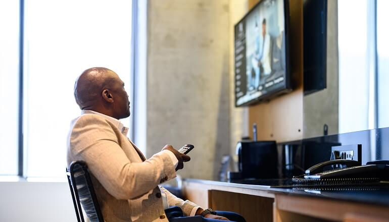 Guy using tv at work
