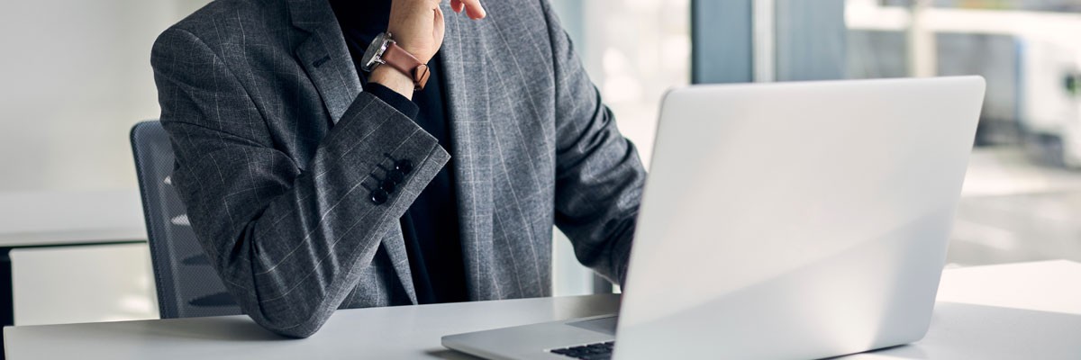 Federal government employee uses laptop computer in open office