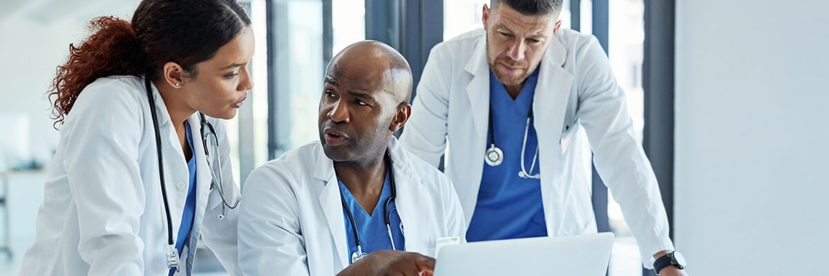 Doctors talk about patient procedures with medical staff