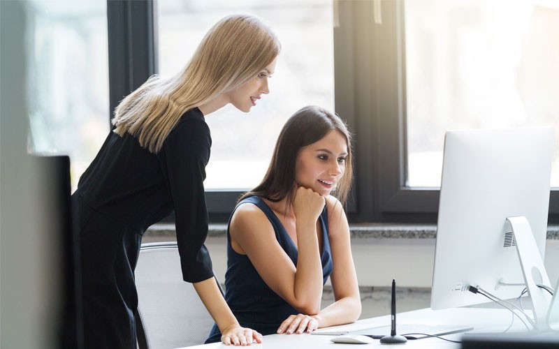 Devices have evolved Business woman working on laptop computer